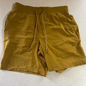 Gold Lulu lemon men’s shorts. Size M